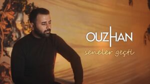 دانلود آهنگ OuzHan Seneler Geçti + ترجمه